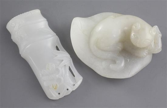 A Chinese white jade carving of a cat seated on a leaf and a second carving of a butterfly on bamboo